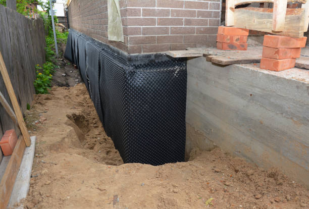 Happy homeowners after waterproofing job in Reliance